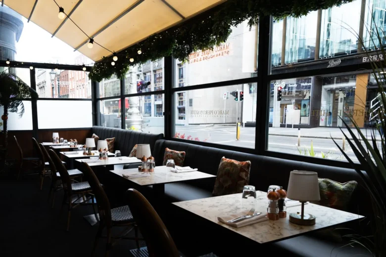 Window banquette seating overlooking Dawson Street at Marco Pierre White Steakhouse & Grill Dublin 2