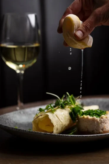 Dressed Castletownbere crab with lemon being squeezed tableside at Marco Pierre White Steakhouse & Grill Dublin 2