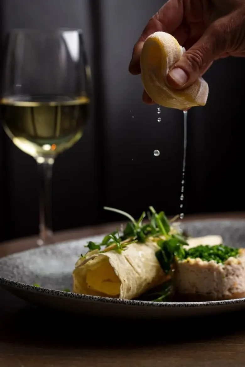 Dressed Castletownbere crab with lemon being squeezed tableside at Marco Pierre White Steakhouse & Grill Dublin 2