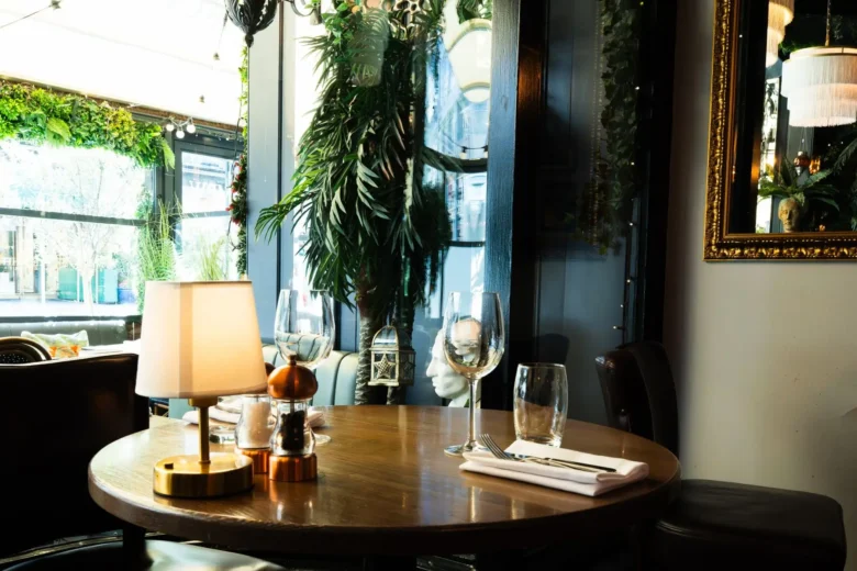 Intimate round table for two set for dinner at Marco Pierre White Steakhouse & Grill, Dawson Street Dublin 2