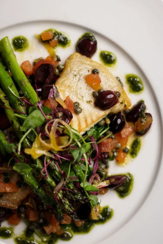 Pan-fried halibut with asparagus, olives, capers and salsa verde at Marco Pierre White Steakhouse & Grill Dublin 2